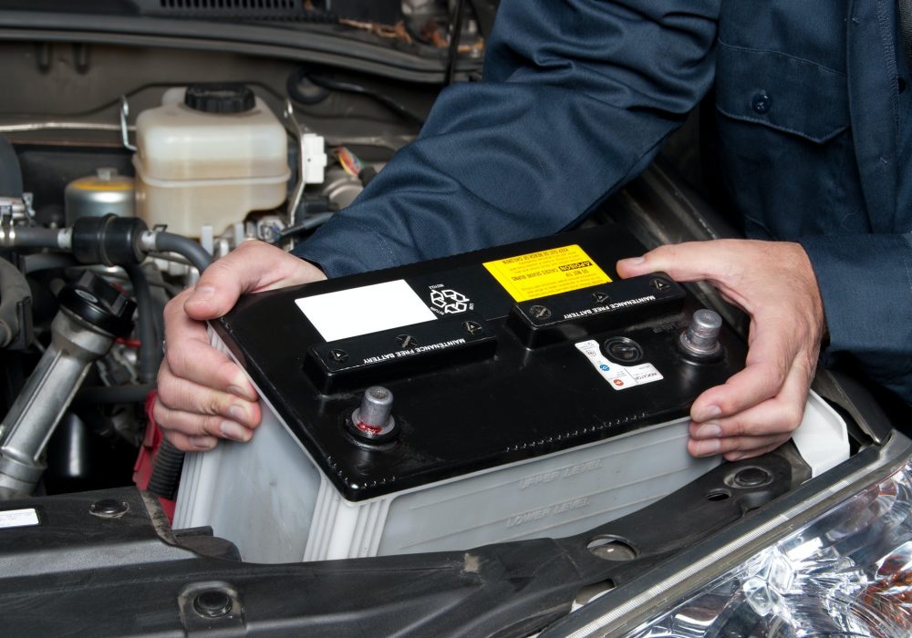 auto mechanic replacing car battery auto mechanic replacing car battery